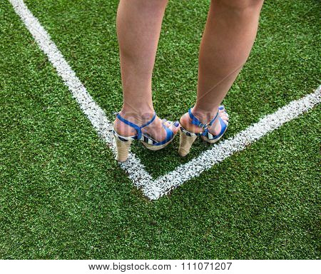 Woman Legs On The Soccer Field