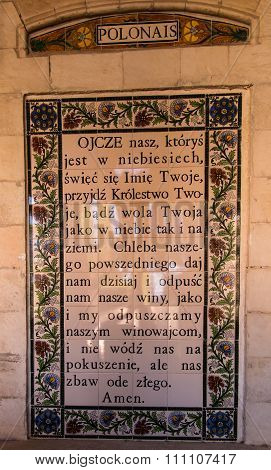 JERUSALEM ISRAEL - JULY 13 2015: Text of the Pater Noster prayer in Polish on one of the walls withi