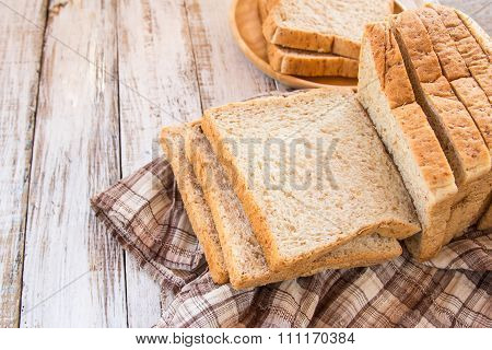 Whole Wheat Bread On White Wooden Background