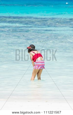 The girl on koh ta chai beach running down into the sea