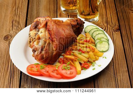 Eisbein With French Fries, Vegetables And Beer