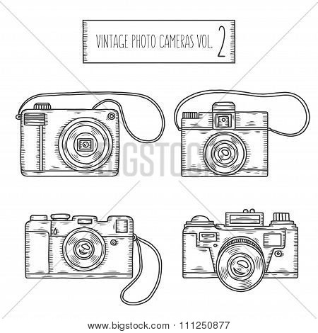 Hand drawn photo cameras set. Vector vintage illustration.