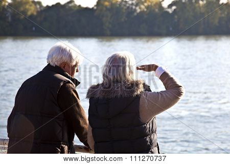 Couple Watching The Nature At The River