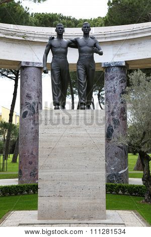 Nettuno - April 06: Bronze Statue Of Two Brothers In Arms Of The American Military Cemetery Of Nettu