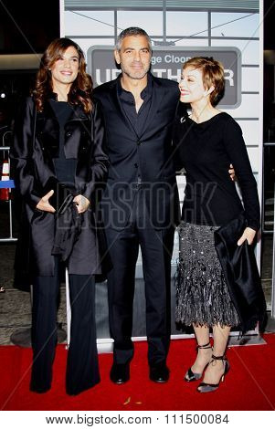Elisabetta Canalis, George Clooney and Nina Warren at the Los Angeles premiere of 'Up In The Air' held at the Mann Village Theatre in Westwood on November 30, 2009. 