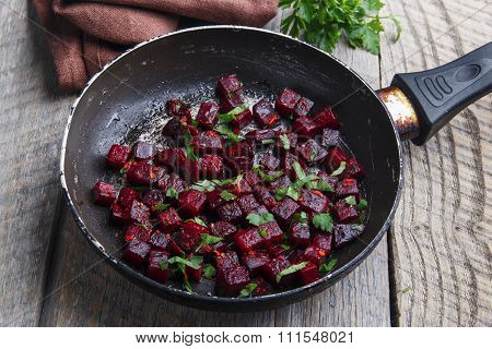 Cooked beets sliced and fried in a pan