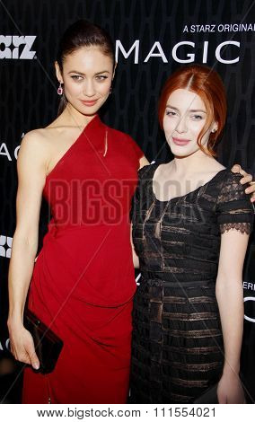 Olga Kurylenko and Elena Satine at the Los Angeles premiere of Starz Series 'Magic City' held at the DGA Theater in Hollywood, USA on March 20, 2012.