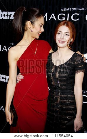 Olga Kurylenko and Elena Satine at the Los Angeles premiere of Starz Series 'Magic City' held at the DGA Theater in Hollywood, USA on March 20, 2012.