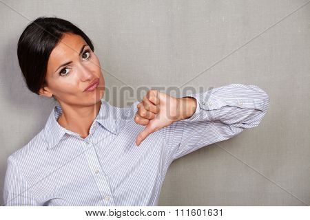 Unsatisfied Adult Female With Thumb Down
