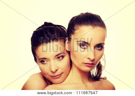 Two attractive sisters with make up.