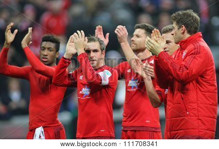 MUNICH, GERMANY - DECEMBER 12 2015: Philipp Lahm of Bayern Munich leads the team applauding fans at the Bundesliga match between Bayern Muenchen and FC Ingolstadt, on December 12, 2015 