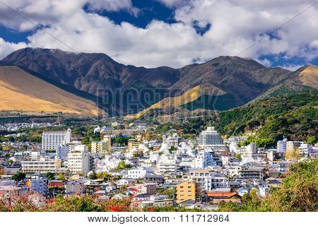 Beppu, Japan cityscape with hot spring bath houses.