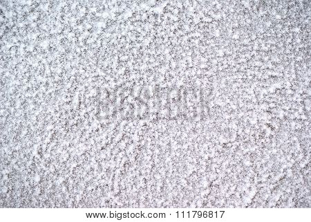 Surface of the plaster wall covered with frost rime ice crystals background