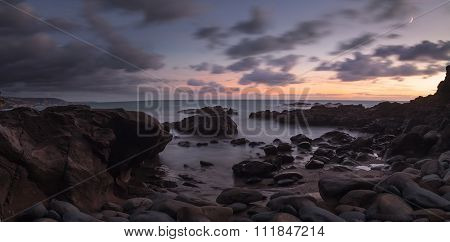 Moonset and sunset at Crescent Bay beach