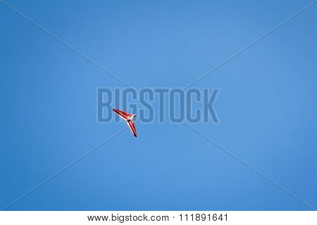 Motorized Hang Glider Soaring In The Blue Sky