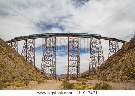 Train driving over Polvorilla Viaduct in Argentina