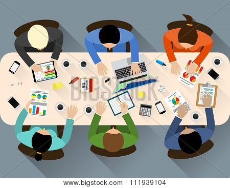 Staff around table