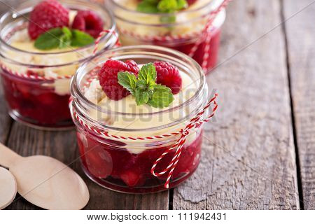 Colorful and delisious dessert in a jar berry cramble