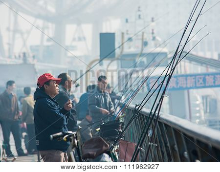 Unidentified Man Is Smoking And Fishing At Tianjin The Bun Park , With Color Splash Effect.