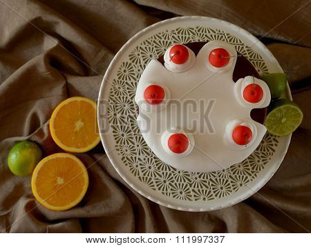 chocolate cake with cherries, decorated with icing