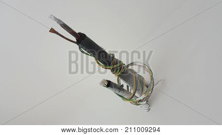 Exposed Air-Conditioner Pipe and Wires Sticking Out of White Wall