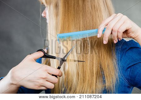 Woman Cutting Down Smoothy Hair.