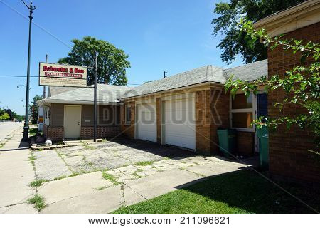 JOLIET, ILLINOIS / UNITED STATES - JULY 25, 2017: Schuster and Son, retired from the plumbing and heating business, have placed a sign not recommending the new business that has taken over their old telephone number.