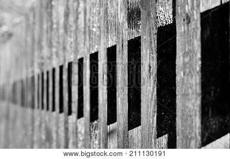 Wooden fence in Spania Dolina in slovakia looks like natural piano. Game of lights and shadows.