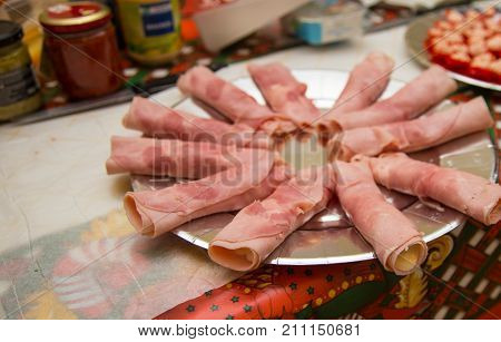 christmas appetizer with ham on silver tray