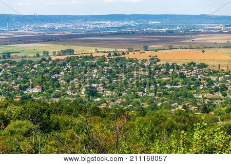 View from the height of the plateau to the village of Madara. Bulgaria.