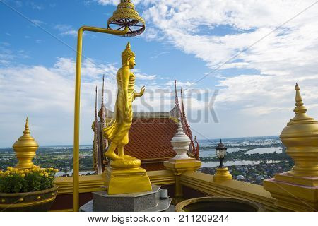 Golden Buddha statue at Wat KeereeWong NakhonSawan Thailand.