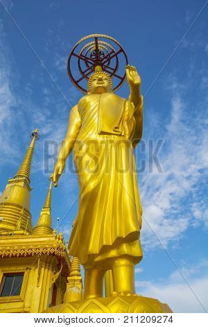 Golden Buddha statue at Wat KeereeWong NakhonSawan Thailand.