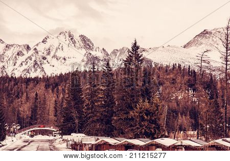 Strbske pleso area center of winter sports High Tatras Slovak republic. Travel destination. Red photo filter.