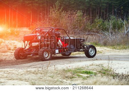 Buggy Car In The Sunlight. Driver With The Second Assistants In The Car Buggy Ride. Riding  Buggy