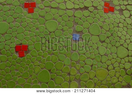 green red texture of ceramic tiles on the wall