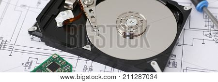 Hard drive from computer or laptop lies on the table in the repair shop. Performs fault diagnostics and performs urgent repairs recovery of lost data during deletion HDD closeup