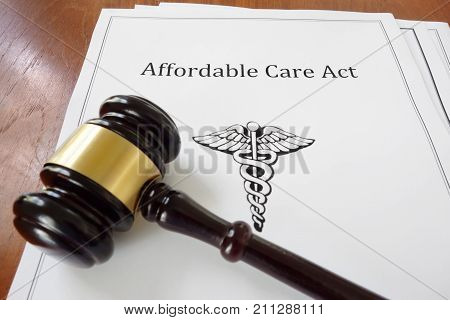Affordable Care Act aka ObamaCare document with a legal gavel
