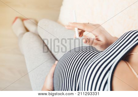 Pregnant Girl With Cigarettes