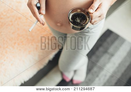 Pregnant Girl With Cigarettes And Coffee
