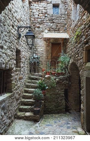 The narrow street in the picturesque village of Lanas in the Ardèche region in France.