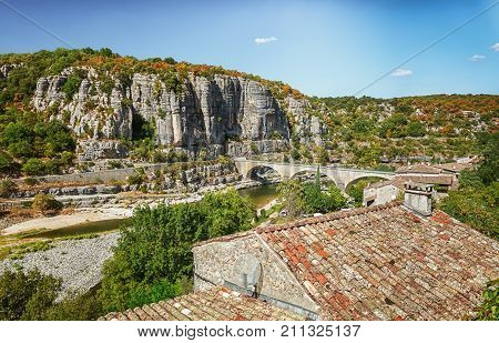 The bridge over the river Ardeche near the old village Balazuc which village is recognized as historical heritage and is considered as one of the charming villages of France