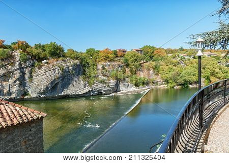 Weir in the Ardeche River near the village of Ruoms in the Ardeche region in France