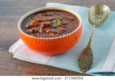 Bowl of traditional soup Borscht on table