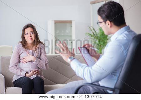 Pregnant woman visiting psychologist doctor