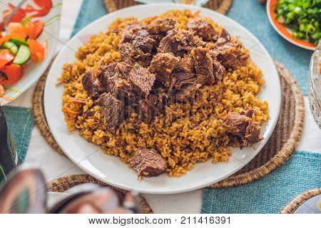 Pilaf With Beef, Carrots, Onions, Garlic, Pepper And Cumin. A Traditional Dish Of Asian Cuisine. Sel
