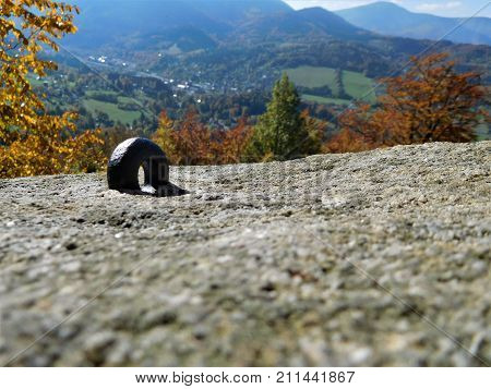 The small iron ringlet for rope on rock for climbing and wonderfull view in the background