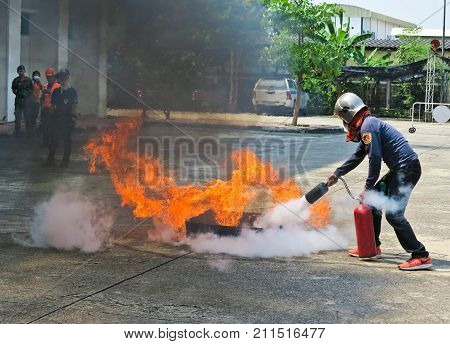 BANGKOK THAILAND - OCTOBER 31 2017 : People preparedness for fire drill and training to use a fire safety tank.