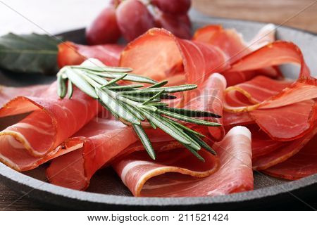 prosciutto with rosemary or ham of black forest or serrano.