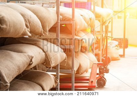 Bags In The Warehouse On The Racks. Coffee, Arabica, Rice