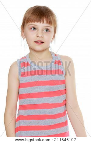 Beautiful little caucasian girl with a short bangs and hair tucked into a tail. In striped in a T-shirt and shorts.